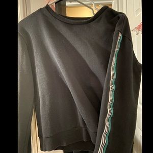 A black sweater with green and white stripes